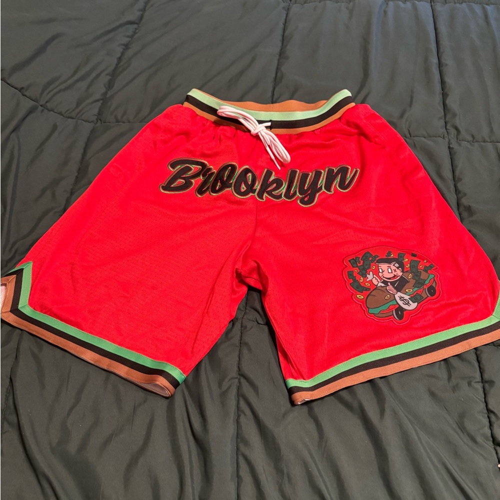 Men’s NWOT Red Athletic Shorts with Brooklyn and Striped Trim.